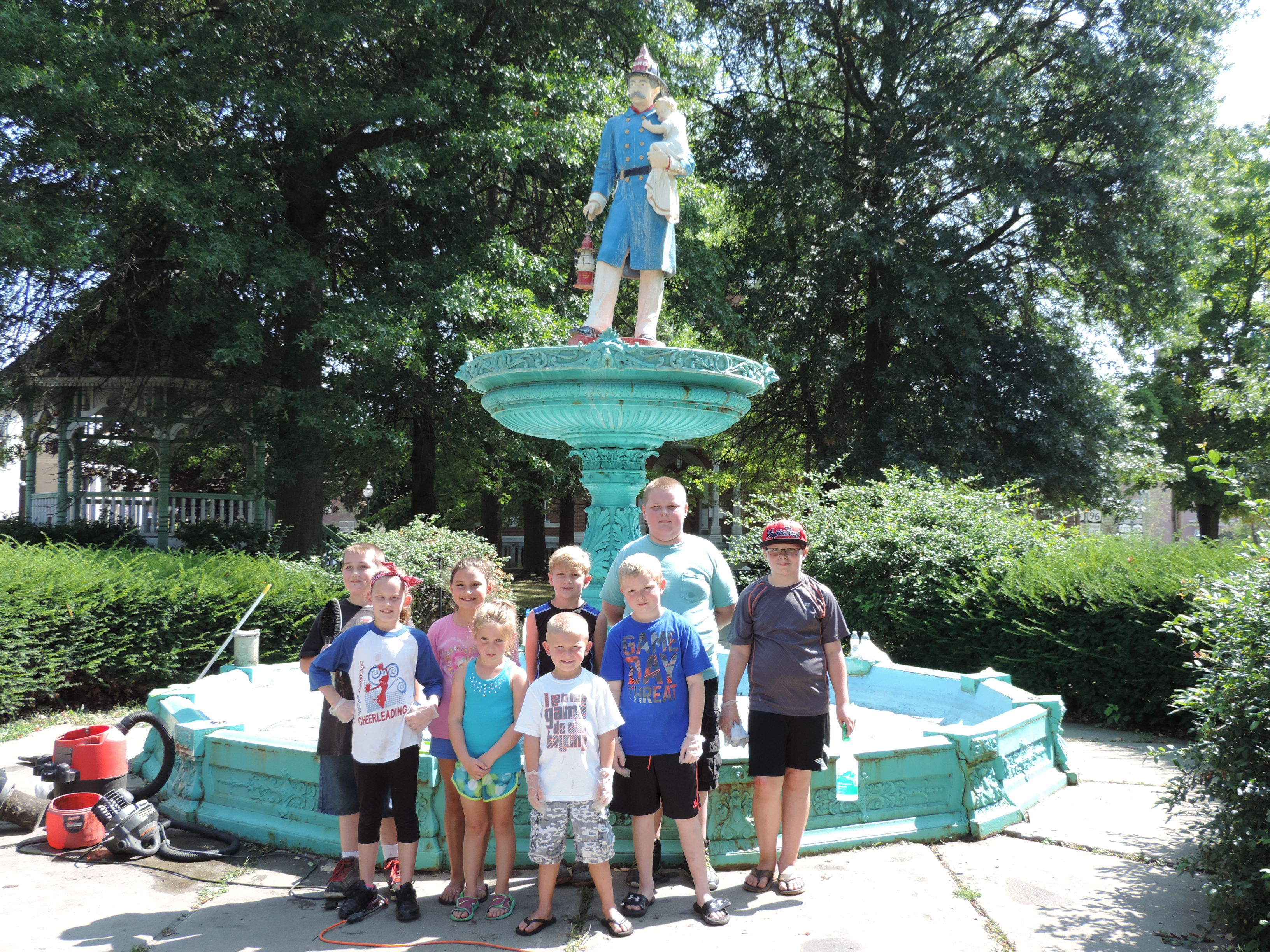 Young people from Owego volunteer to clean Baker Memorial Fountain