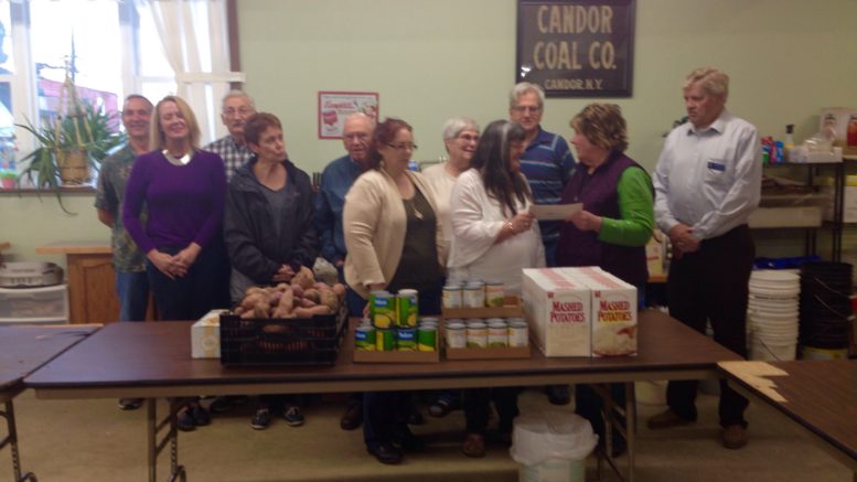 Lions Club members donate to the community