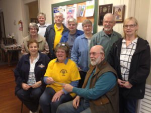 Lions Club members donate to the community