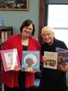 Women’s chapter donates books to the library in honor of Black History Month