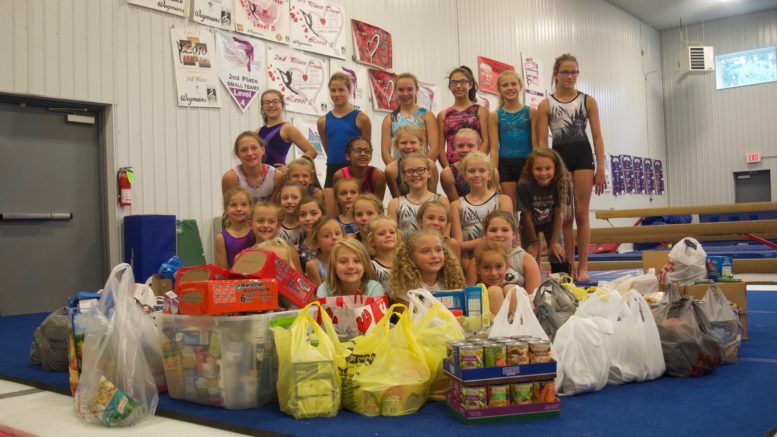 Day campers collect food for Rural Ministries