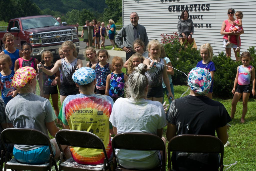 Day campers collect food for Rural Ministries