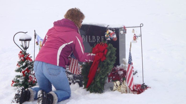 On a cold Saturday afternoon, Gold Star Mother Barbara Bilbrey went to her fallen hero son’s grave to place a wreath in his honor. Twenty-one-year-old Army Specialist Charles E. Bilbrey Jr. was killed on July 26, 2007, when a makeshift bomb exploded near his vehicle in Saqlawiyah, Iraq, in Operation Iraqi Freedom. He had volunteered for the mission that claimed his life. The 2005 Owego Free Academy (OFA) graduate is the recipient of the Bronze Star Medal and Purple Heart. OFA Principal Ronald Pierce said that Specialist Bilbrey left a lasting legacy of patriotism, respect and leadership at the school.  The Gold Star Bilbrey Family, Charles and Barbara, and sister Shannon and brother Patrick, also placed a wreath at the entrance to St. Patrick's Cemetery in the Town of Tioga as part of Wreaths Across America in Tioga County and the Valley.  Here is the meaning of Wreaths Across America Day from Gold Star Mother, Mrs. Barbara Bilbrey:  “We recently marked the 12th year since we lost Charlie. I retired as an obstetric nurse at Lourdes Hospital in Binghamton. Now I’m with the Tioga County Health Department.  “Even after 12 years Charlie is the first thing I think of in the morning and the last thought I have at night.   “For anyone who has suffered a loss, the Christmas season can be very difficult to get through.  “This brief time during the Christmas season gives us all a small moment to pause during the holiday season and reflect on the service members, past and present, who have served our country and the families who are passing the holiday season without them. It has been part of our holiday plans since Charlie has died.” Parents Barbara and Charlie Bilbrey were expected to travel to Fort Stewart, Ga. to participate in the Warrior’s Walk on Saturday, Dec. 14. For the 12th year, families from across the nation pay their respects and grieve the loss of 3rd Infantry Division Soldiers including their son, Charles Bilbrey, at the Wreaths for Warriors Walk. It’s an annual event that began in 2007 with the goal of placing a Christmas wreath at the memorial of each and every Fallen Soldier along the Warriors Walk in coordination with Wreaths Across America as a solemn memorial service.  Barbara Bilbrey says the event is a reminder to Soldiers across the spectrum that their selflessness in defending our nation is never forgotten and always appreciated.