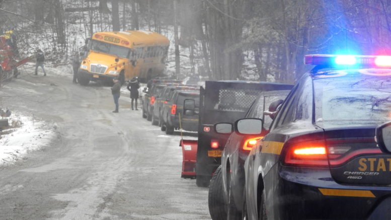 Bus rolls over on icy road in Candor; two students on bus