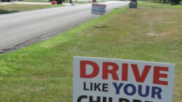 Neighborhood signs staged to alert motorists