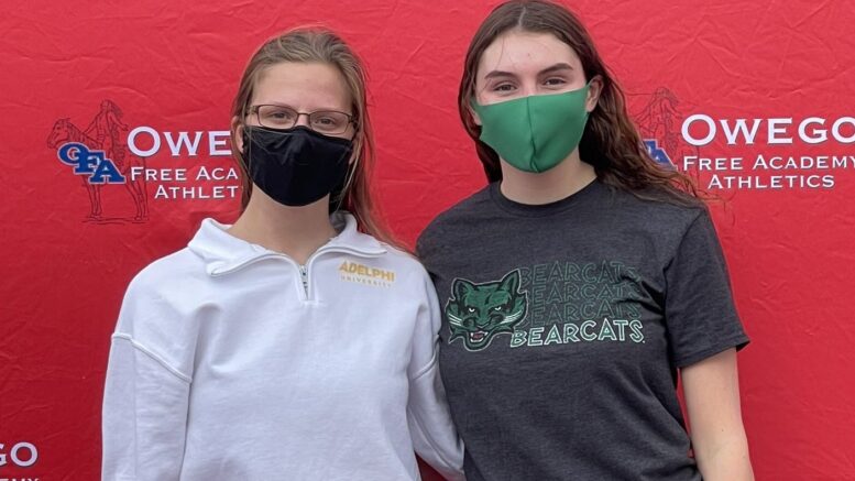 Two athletes sign on to continue athletic career