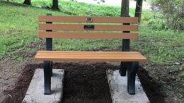 Owego Lions place a bench at Lions Camp Badger to honor their deceased members