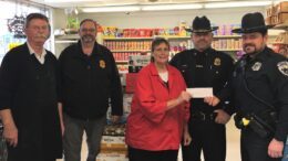 Iconic mustache benefits officer battling cancer