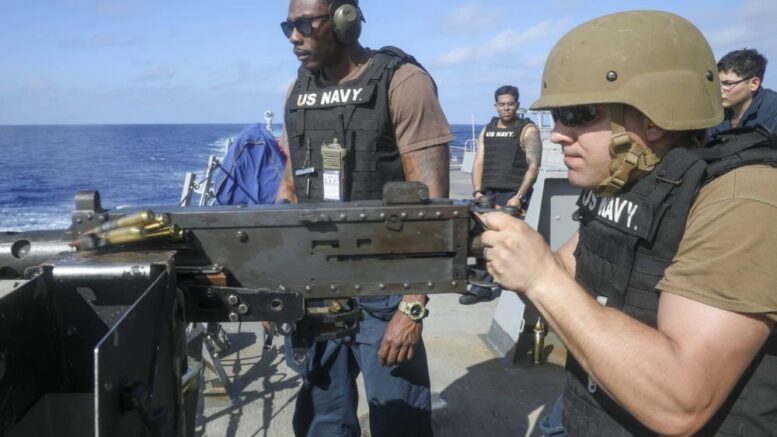 Lisle, N.Y. resident fires machine gun during service with Navy Squadron