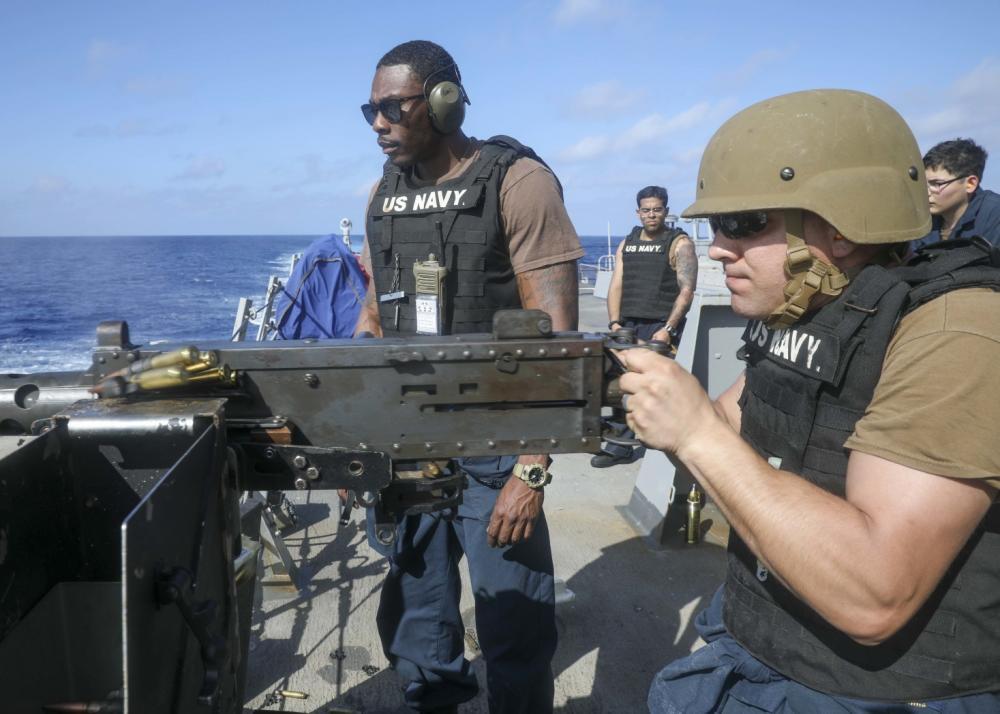 Lisle, N.Y. resident fires machine gun during service with Navy Squadron