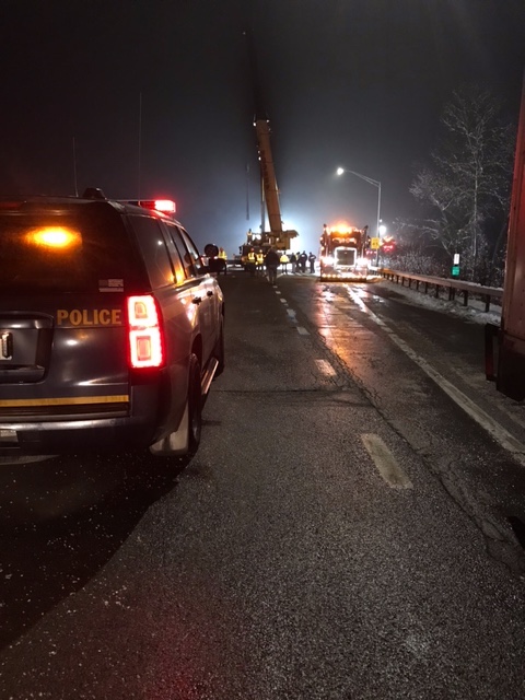 Crane helps remove large piece of machinery off 17