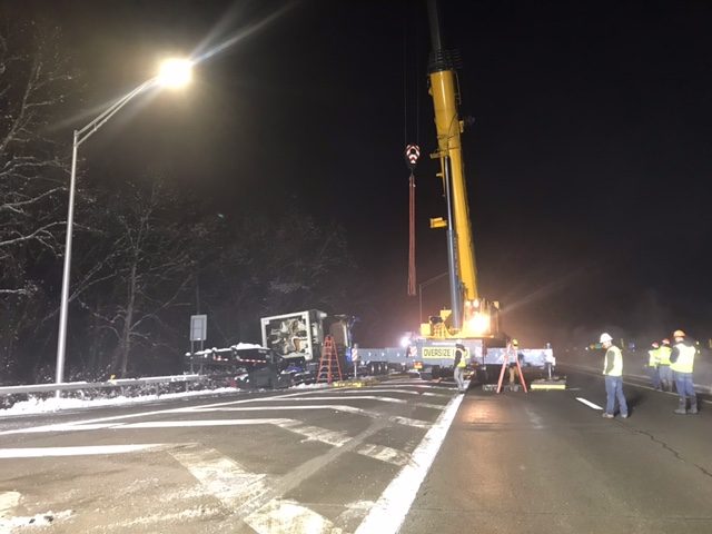 Crane helps remove large piece of machinery off 17