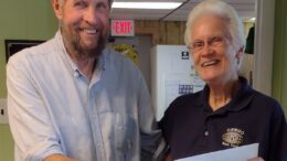 The Old Coot presents check to Sister Mary
