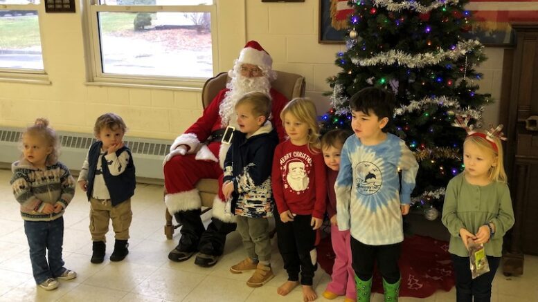 Spencer Library hosts visit by Santa for Storytime